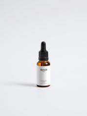 Braune Glasflasche mit Pipette, beschriftet mit 'PILOI' und 'Coffeine Gel Booster';